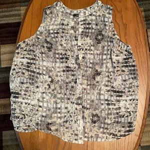 Sleeveless. Lightweight. Button up blouse.